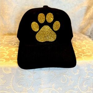Black Baseball Cap with a Gold Paw print.